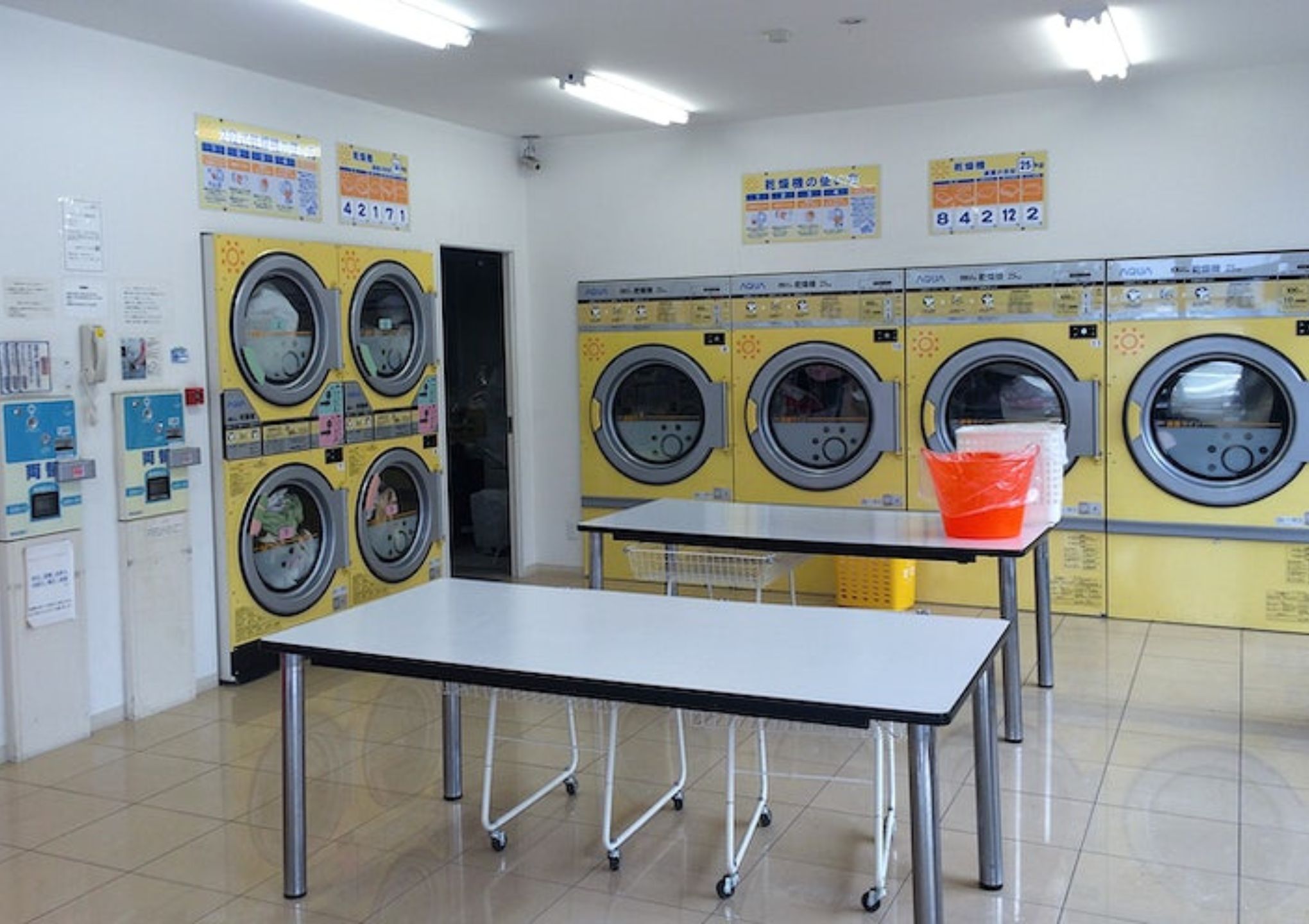 an internal picture of coin laundry shop with yellow machines – Post Featured Image an internal picture of coin laundry shop with yellow machines - Post Featured Image